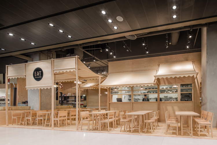 Onion's solid ash and plywood restaurant interior in Bangkok
