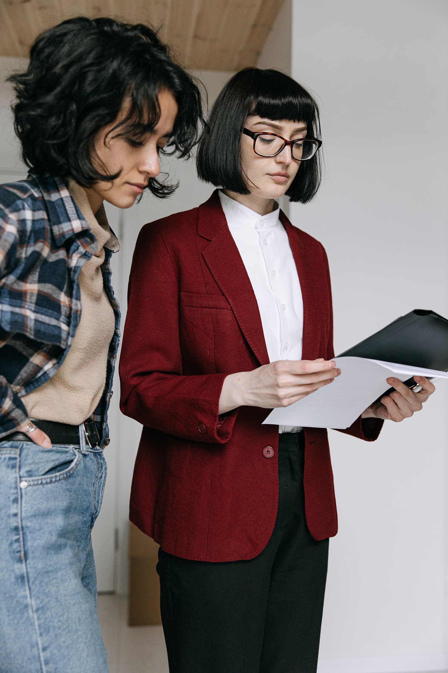 Young real estate agent signs sales contract